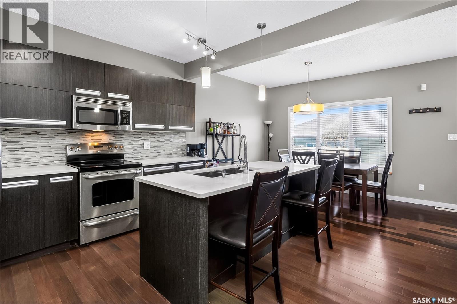 934 Stonebridge Common, Saskatoon, SK - Indoor Photo Showing Kitchen With Double Sink With Upgraded Kitchen