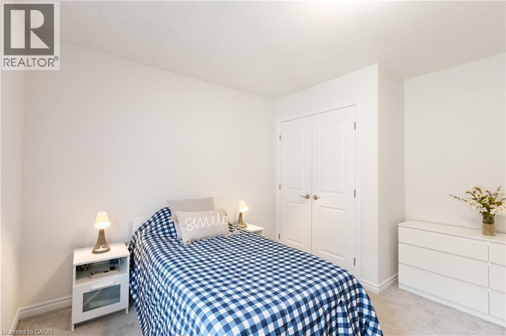 Bright room with light-toned walls and plush carpeting - 581 Doonwoods Crescent, Kitchener, ON - Indoor Photo Showing Bedroom