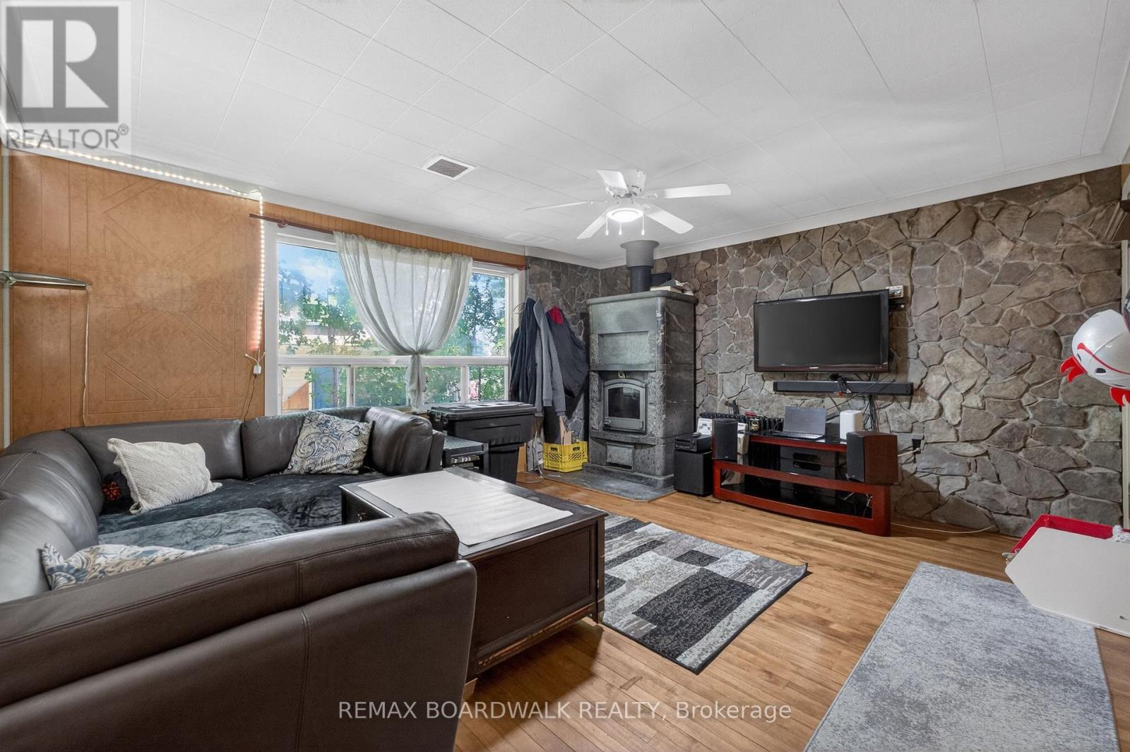 Living Room w/a WETT- Certified Wood Stove - 92 Orvigale Road, Ottawa, ON - Indoor Photo Showing Living Room
