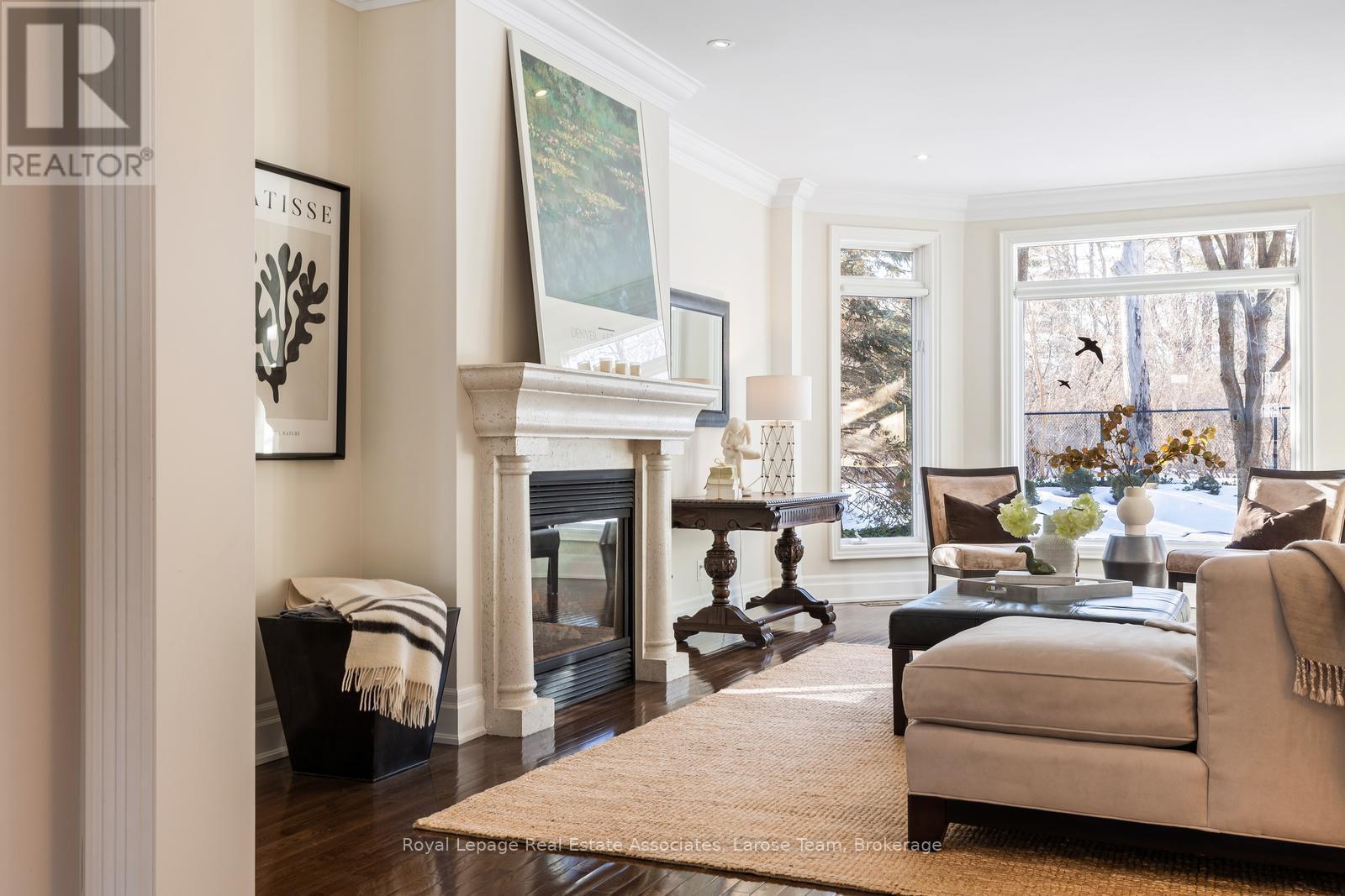 Double-sided Gas Fireplace in Great Room - 562 Gladwyne Court, Mississauga, ON - Indoor Photo Showing Living Room With Fireplace