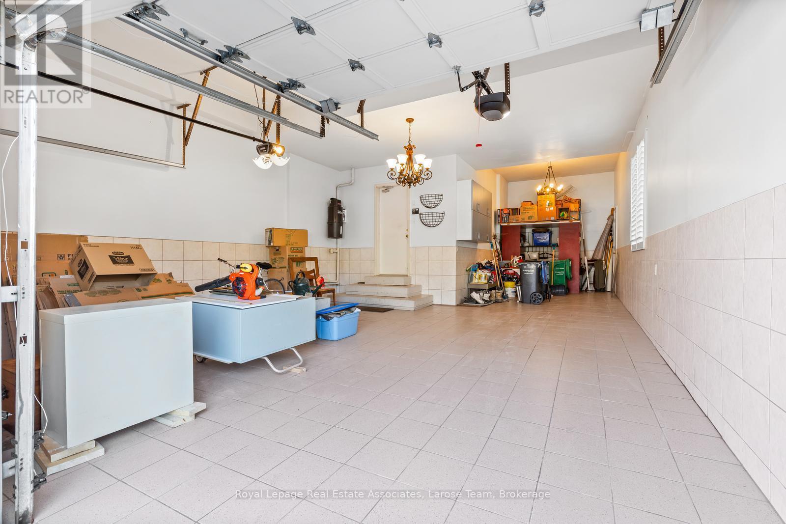 3 Car- Tandem Garage with Porcelain Tiled Floor - 562 Gladwyne Court, Mississauga, ON - Indoor Photo Showing Other Room