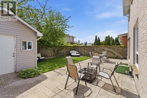 Expansive outdoor patio with stamped concrete pavers - 27 Barbara Court, Hamilton, ON - Outdoor With Deck Patio Veranda