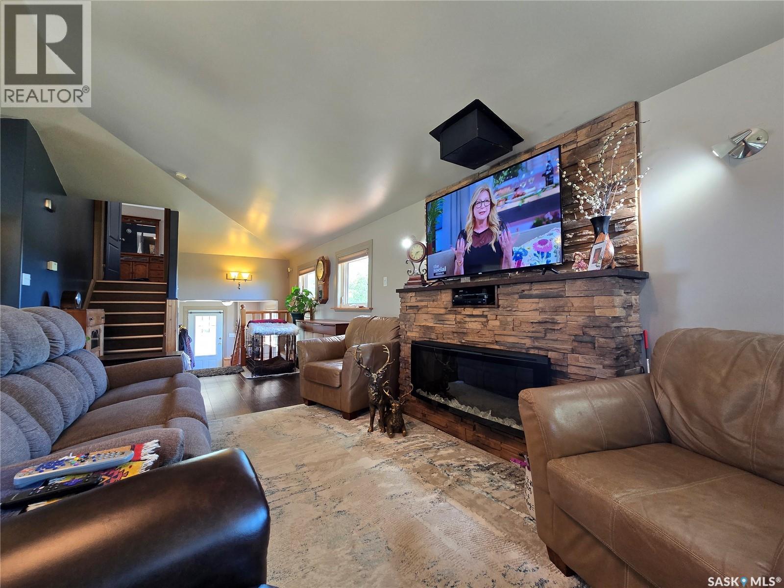 43 Assiniboia Avenue, Mctaggart, SK - Indoor Photo Showing Living Room With Fireplace