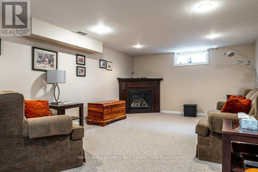 Rec Room With Gas Fire Place - 271 Devon Street, Stratford, ON - Indoor Photo Showing Basement
