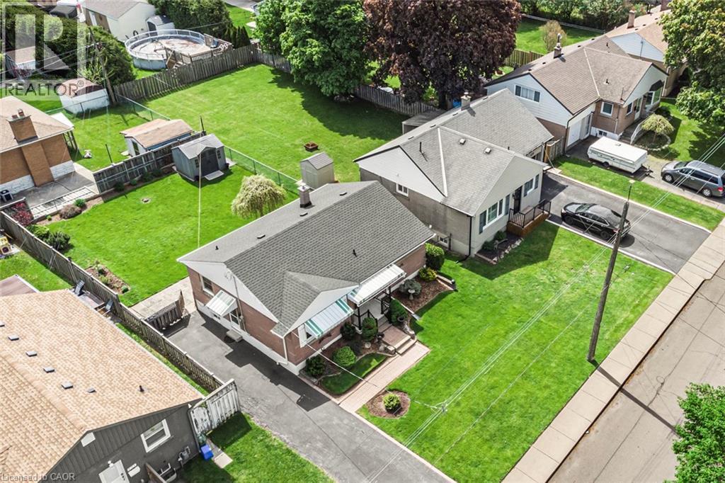 Property featuring a brick exterior and sloped roofline - 435 East 36Th Street, Hamilton, ON - Outdoor