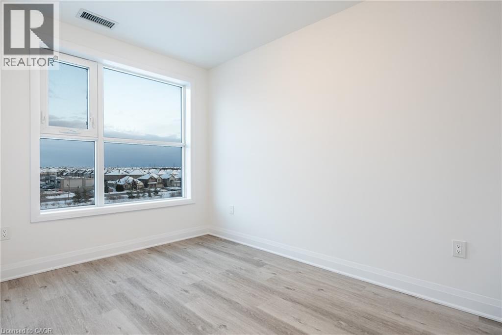 Expansive window offering broad natural illumination and neighborhood views - 1936 Rymal Road E Unit# 512, Hamilton, ON - Indoor Photo Showing Other Room