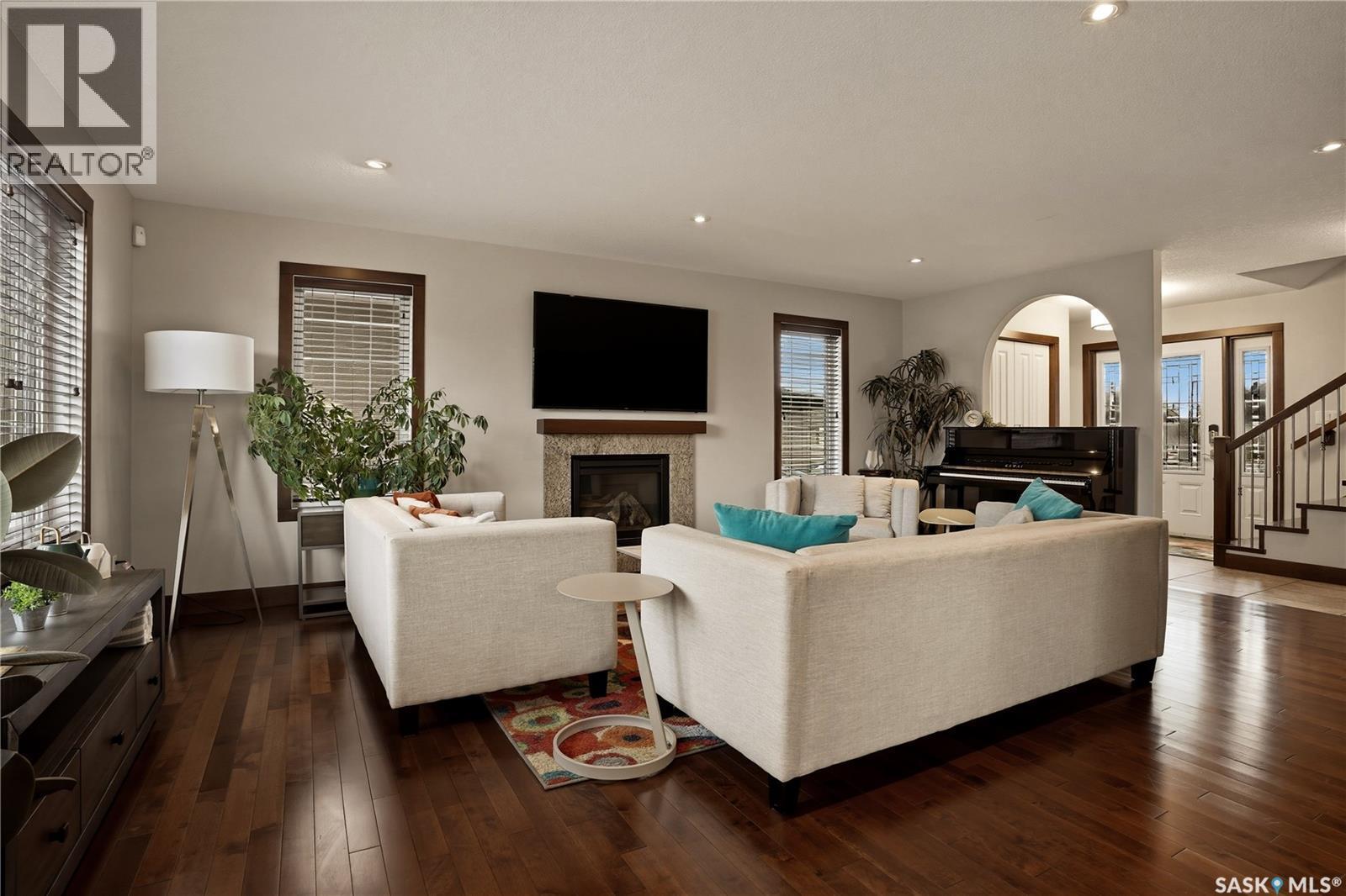 8034 Fairways West Drive, Regina, SK - Indoor Photo Showing Living Room With Fireplace
