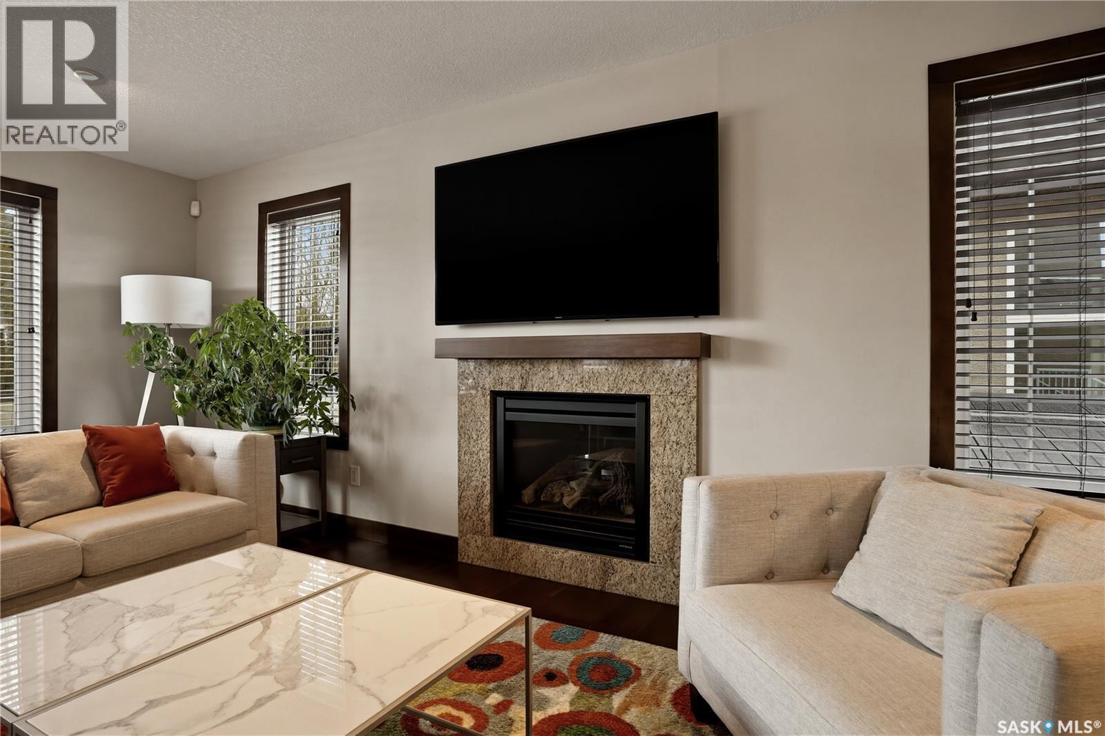 8034 Fairways West Drive, Regina, SK - Indoor Photo Showing Living Room With Fireplace