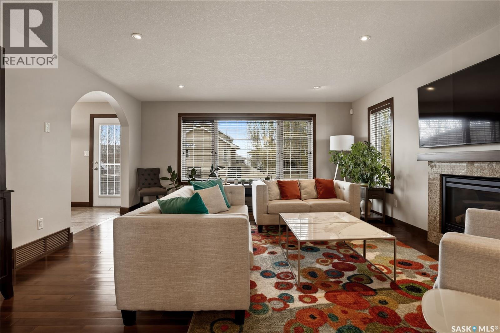 8034 Fairways West Drive, Regina, SK - Indoor Photo Showing Living Room With Fireplace
