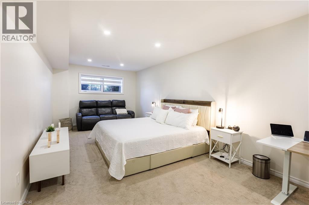 Spacious room featuring neutral carpeting and recessed lighting - 10 Redbud Crescent, Simcoe, ON - Indoor Photo Showing Bedroom