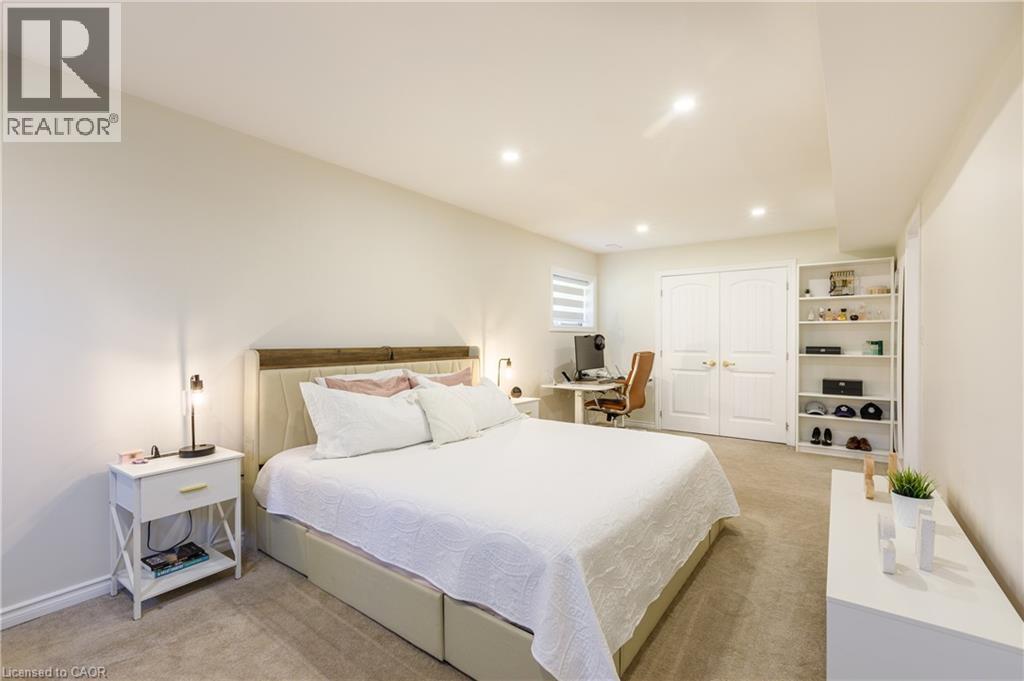 Light-colored wall-to-wall carpeting complements the neutral wall tones - 10 Redbud Crescent, Simcoe, ON - Indoor Photo Showing Bedroom