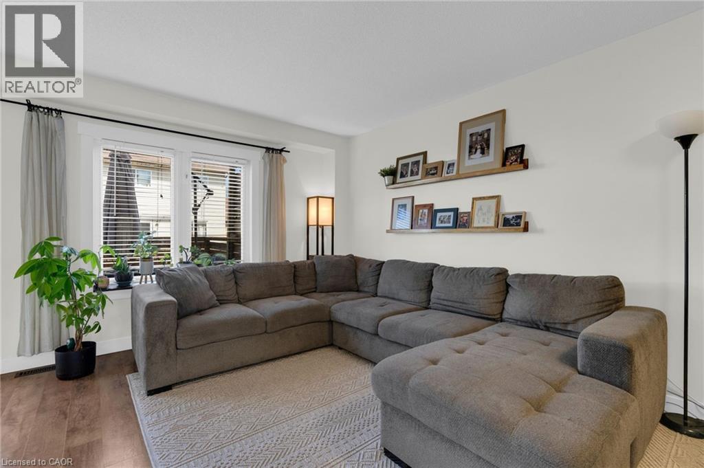 Living Room opens up to the Dining and Kitchen Area - 4 Parkside Crescent, Angus, ON - Indoor Photo Showing Living Room