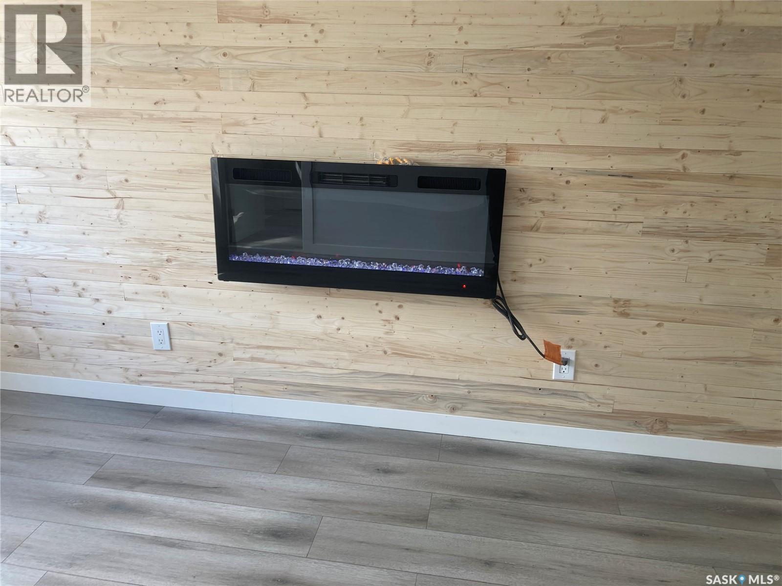 349 X Avenue S, Saskatoon, SK - Indoor Photo Showing Other Room With Fireplace