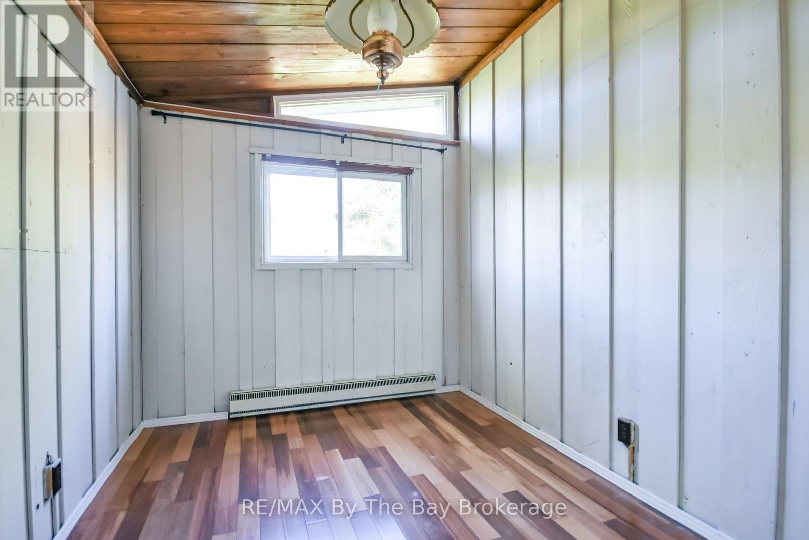 Second Bedroom - 22 Talon Trail, Tiny, ON - Indoor Photo Showing Other Room