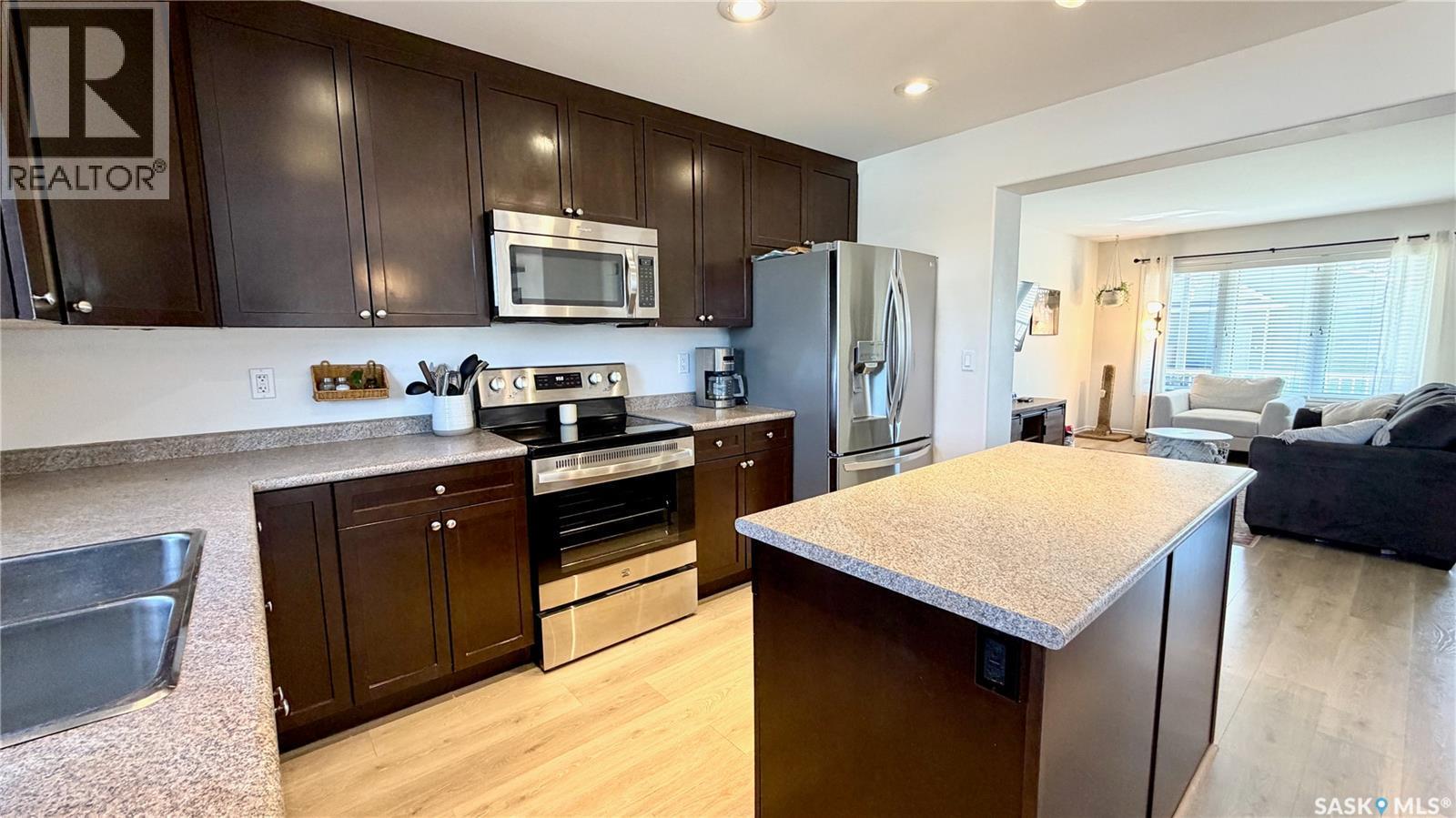 230 Veltkamp Lane, Saskatoon, SK - Indoor Photo Showing Kitchen With Double Sink