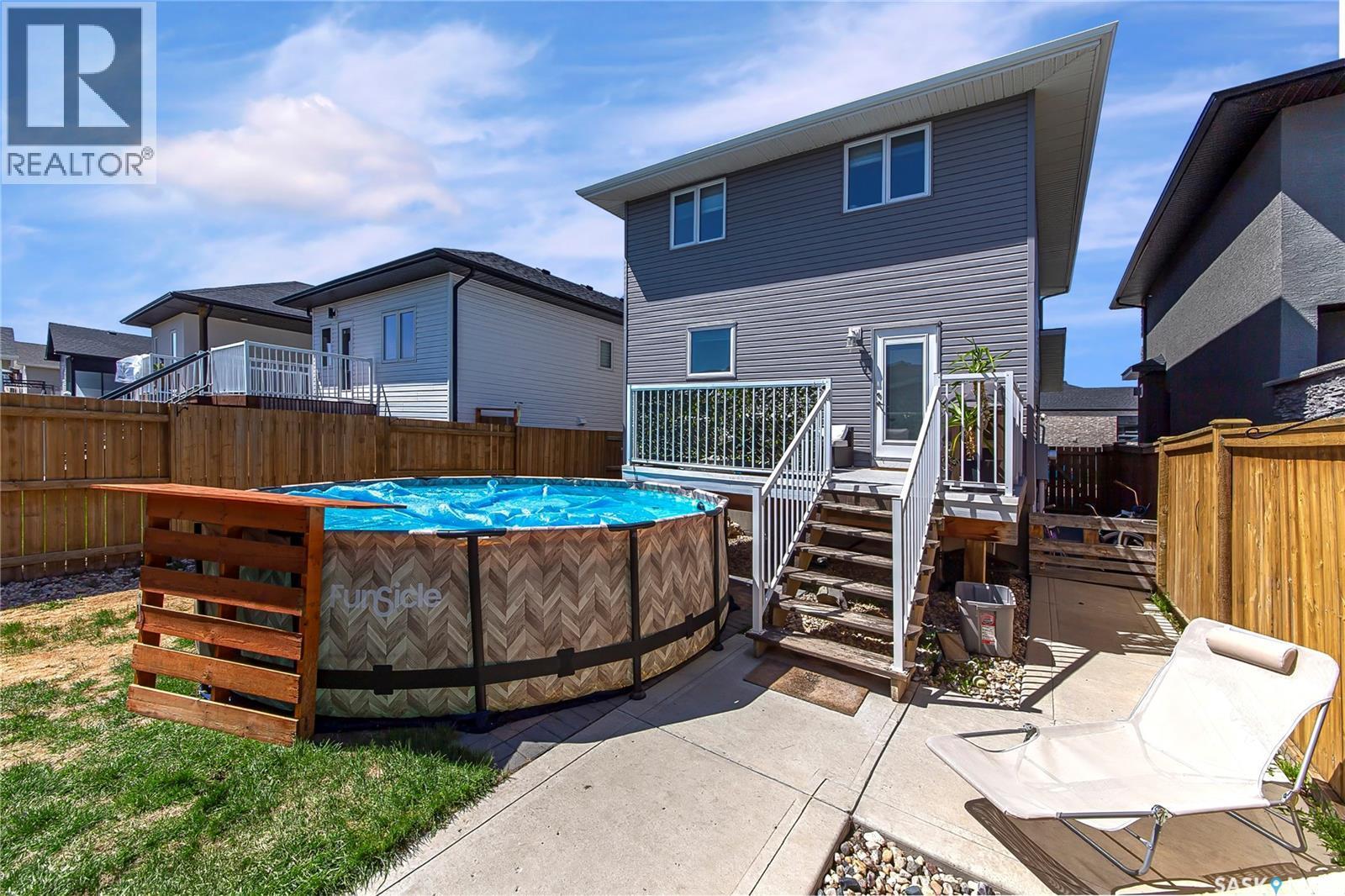 246 Fast Lane, Saskatoon, SK - Outdoor With Above Ground Pool