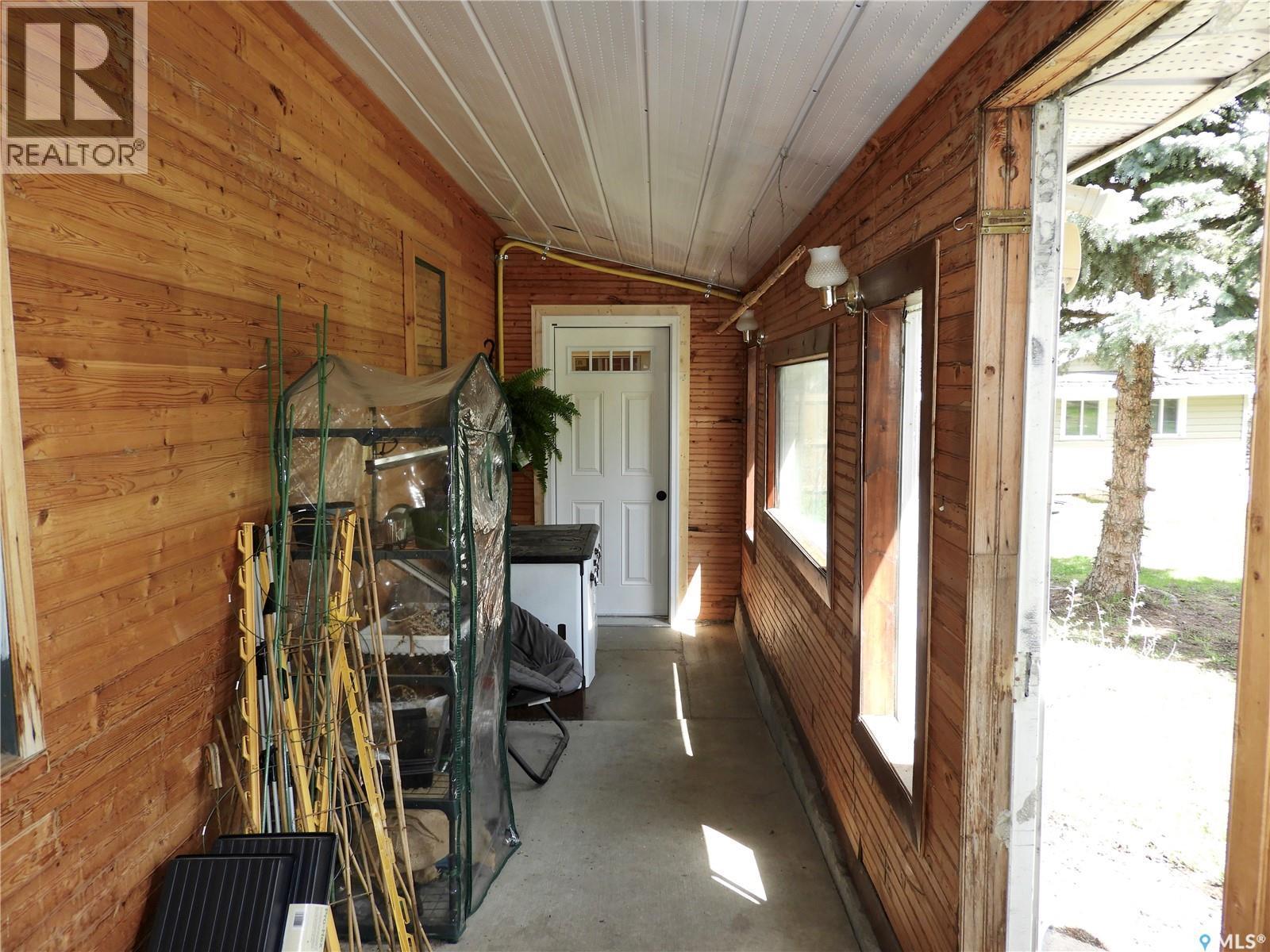 109 Windsor Avenue, Hague, SK - Indoor Photo Showing Other Room With Fireplace