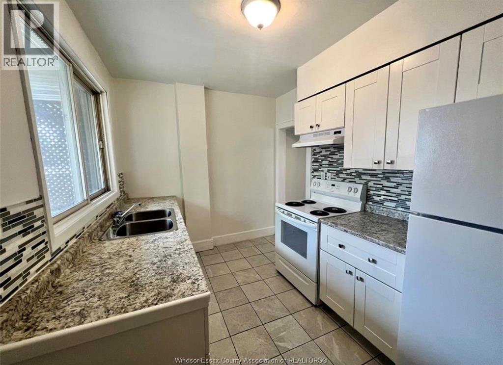 3458 Harris, Windsor, ON - Indoor Photo Showing Kitchen With Double Sink