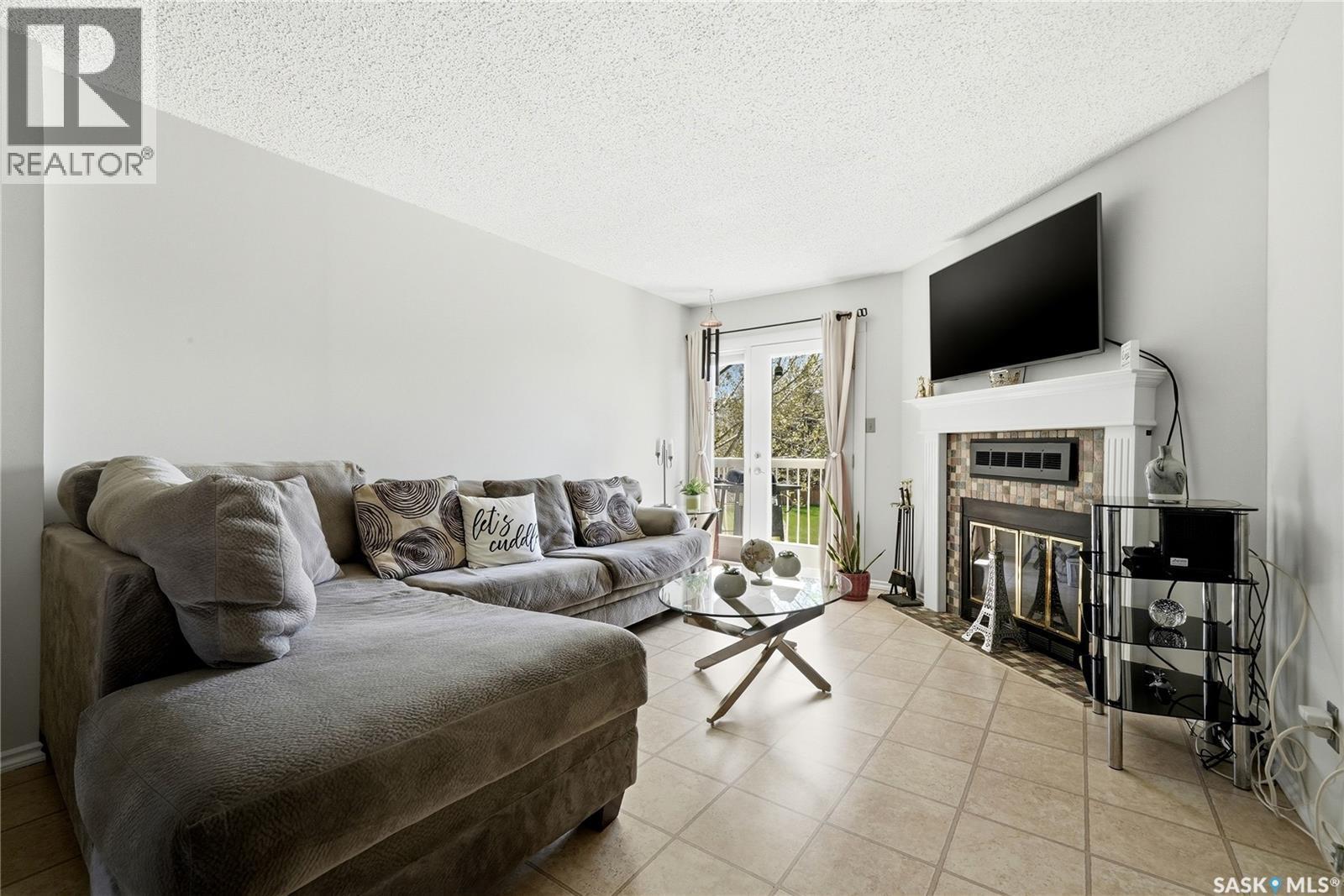 6427 Rochdale Boulevard, Regina, SK - Indoor Photo Showing Living Room With Fireplace