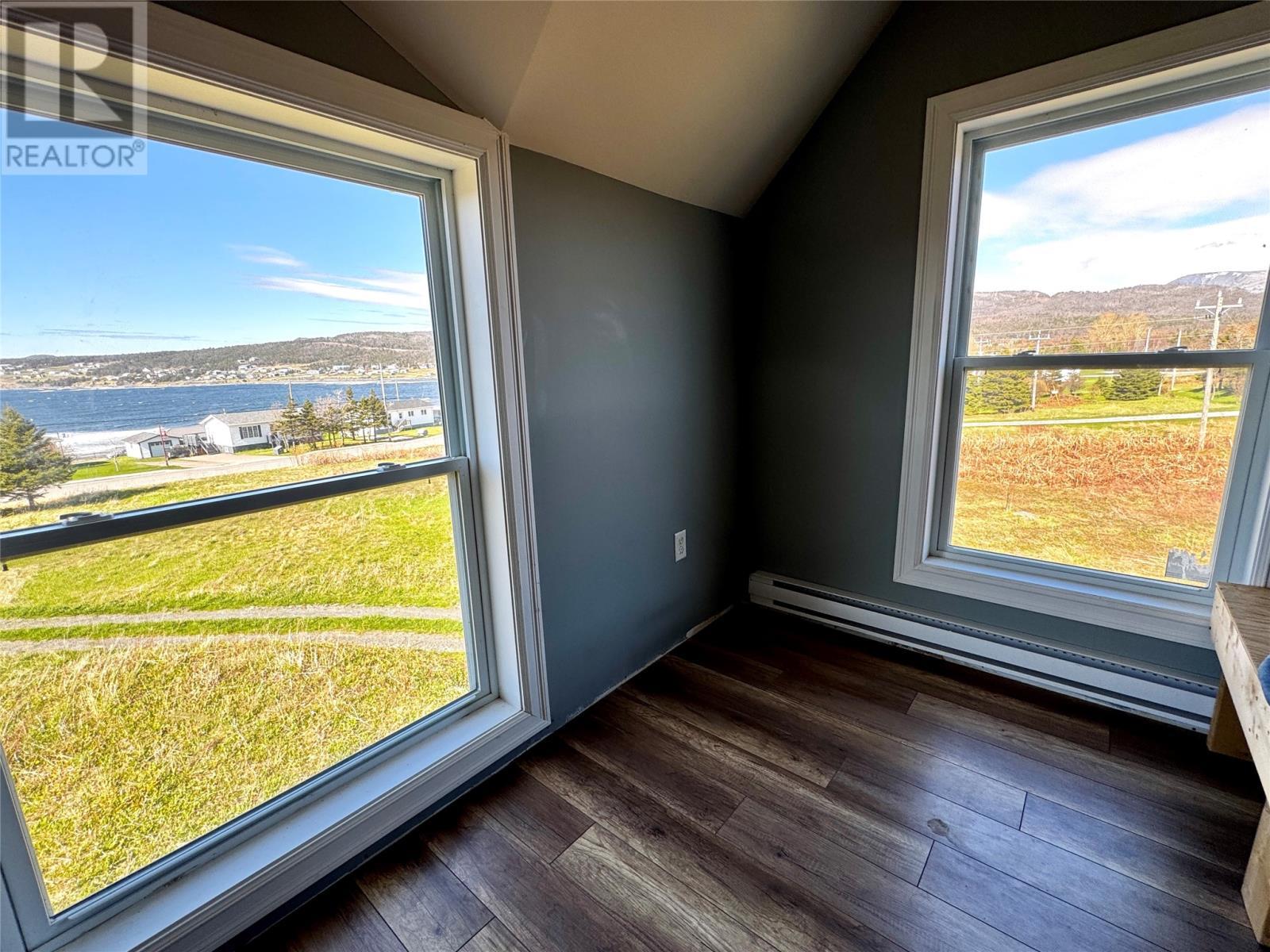 25-27 Main Street S, Rocky Harbour, NL - Photo Showing Other Room With Body Of Water