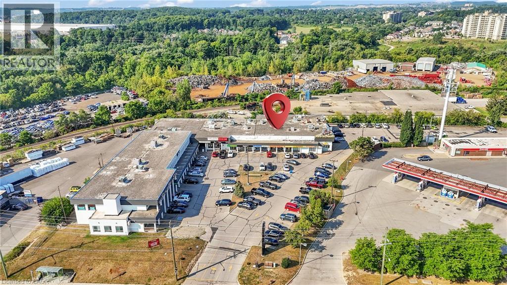 Aerial perspective showcasing commercial properties - 5 Manitou Drive Unit# 106B, Kitchener, ON