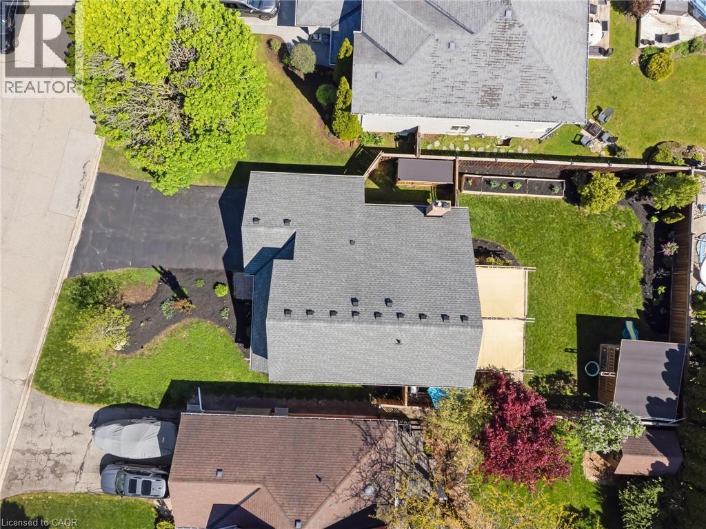 Well-maintained shingle roof and a spacious, manicured backyard - 42 Handorf Drive, Cambridge, ON - Outdoor With Deck Patio Veranda