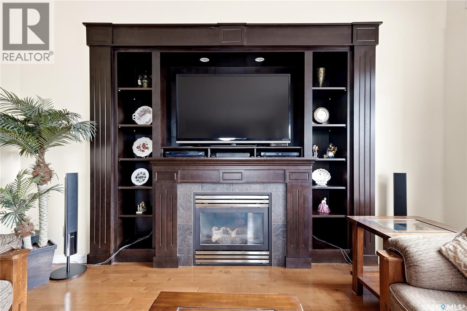 2534 Windsor Park Road, Regina, SK - Indoor Photo Showing Living Room With Fireplace