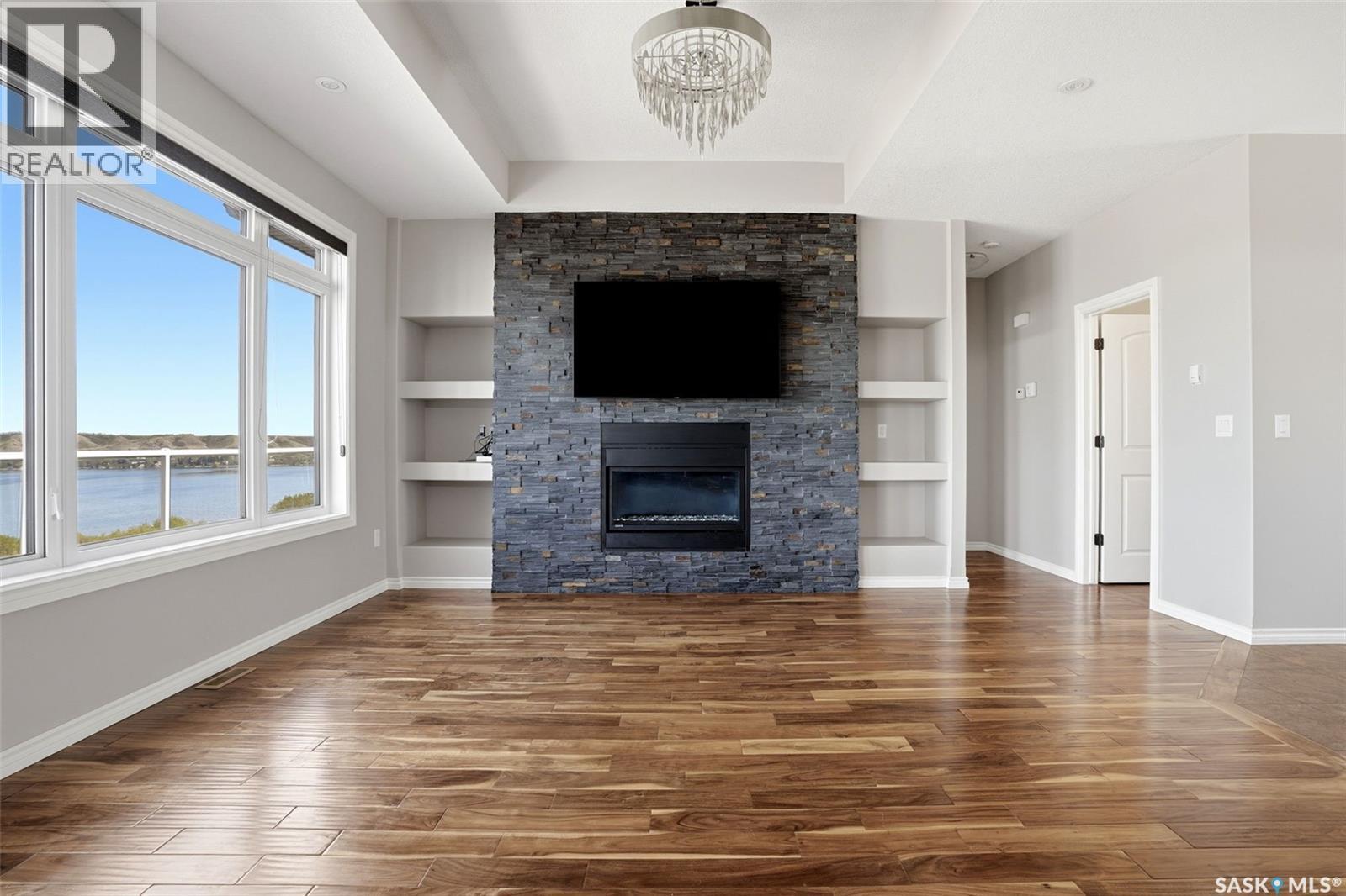 701 Saskatoon Drive, Katepwa Beach, SK - Indoor Photo Showing Living Room With Fireplace