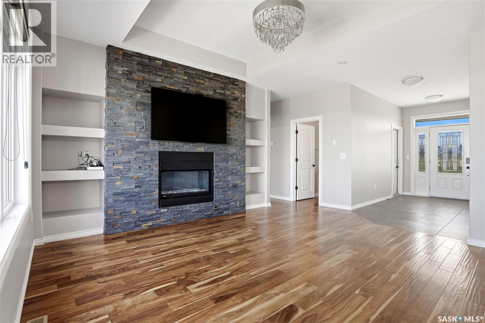 701 Saskatoon Drive, Katepwa Beach, SK - Indoor Photo Showing Living Room With Fireplace