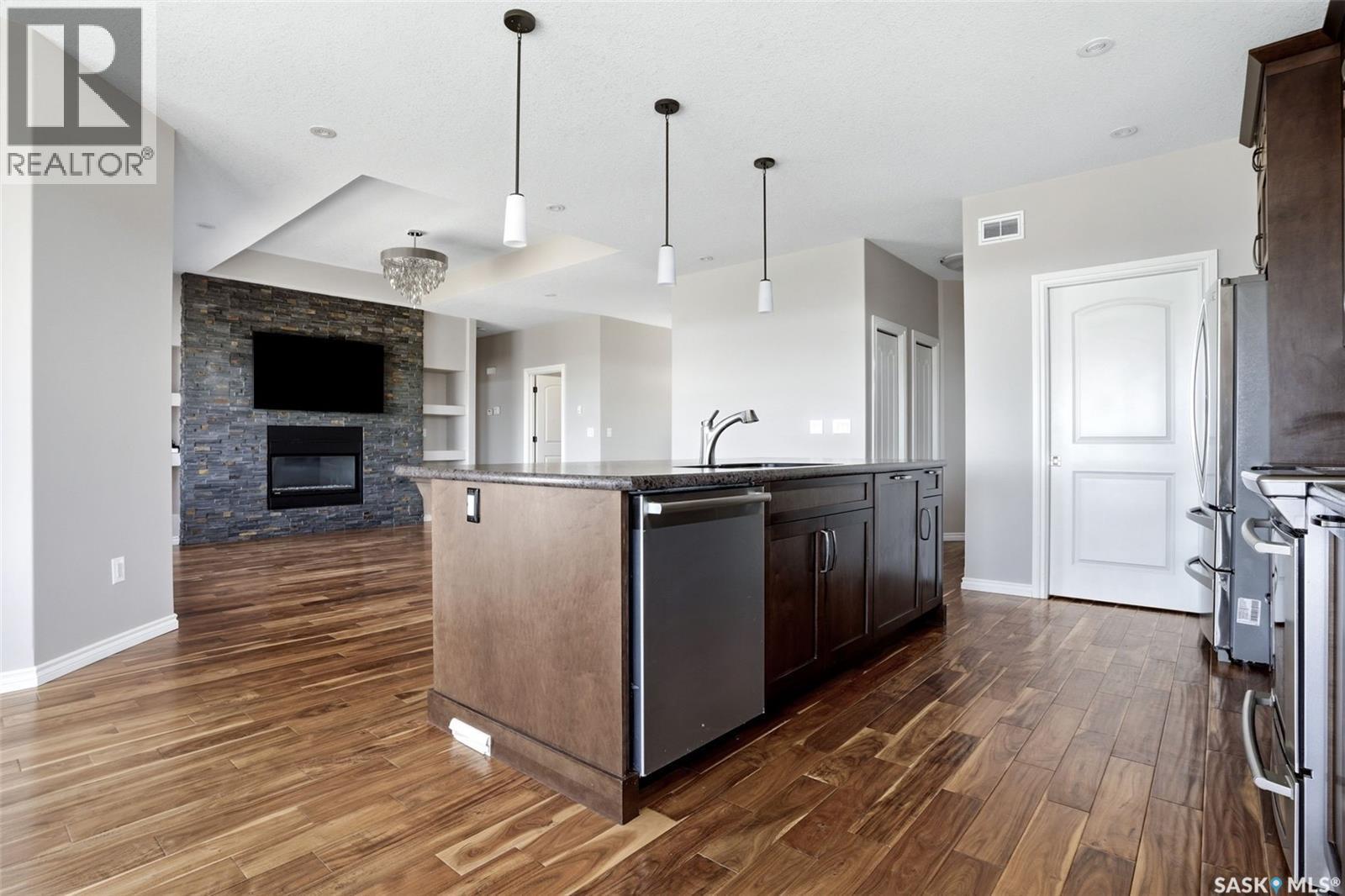 701 Saskatoon Drive, Katepwa Beach, SK - Indoor Photo Showing Kitchen With Fireplace With Upgraded Kitchen