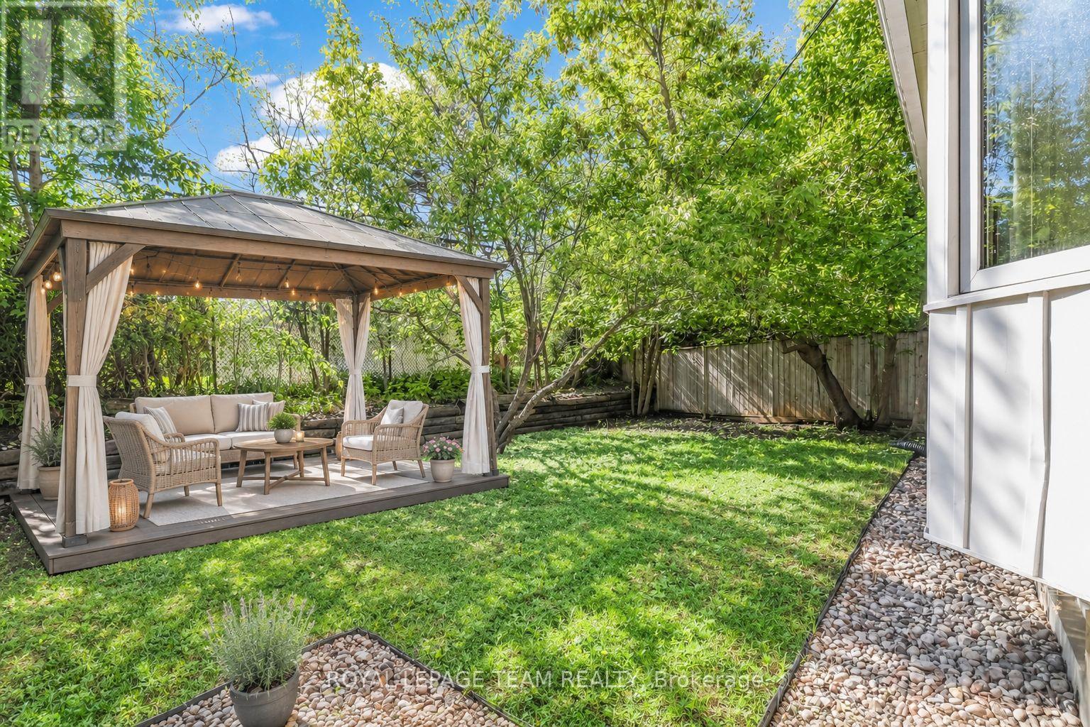 Photo has been virtually staged - 2317 Elmira Drive, Ottawa, ON - Outdoor With Backyard