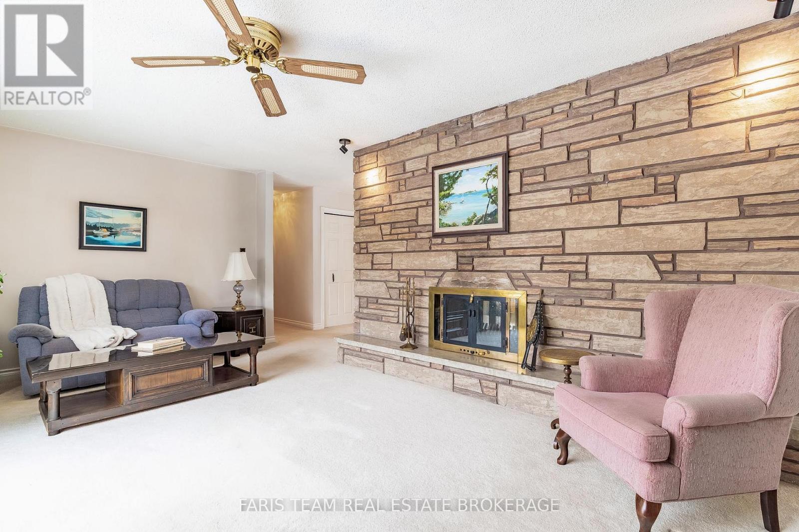 21 Pooles Road, Springwater, ON - Indoor Photo Showing Living Room With Fireplace