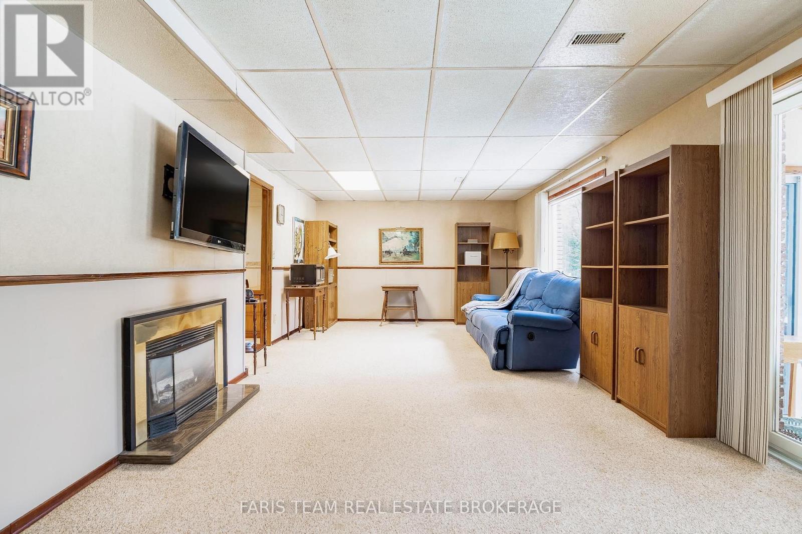 21 Pooles Road, Springwater, ON - Indoor With Fireplace