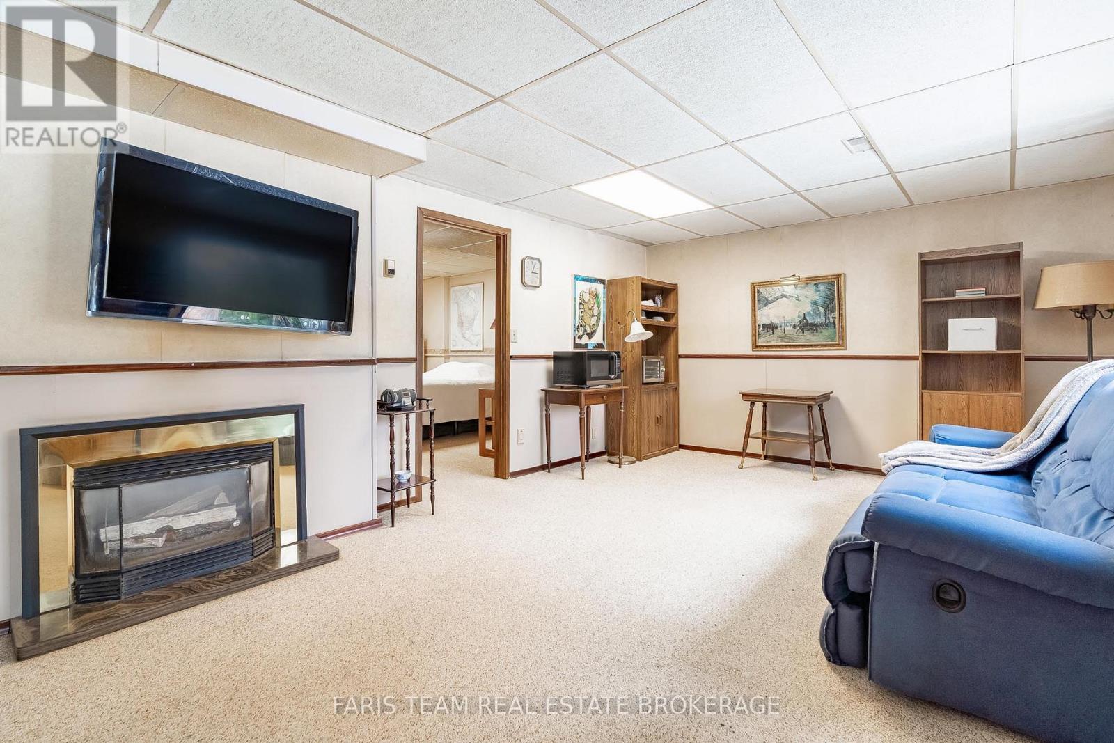 21 Pooles Road, Springwater, ON - Indoor With Fireplace