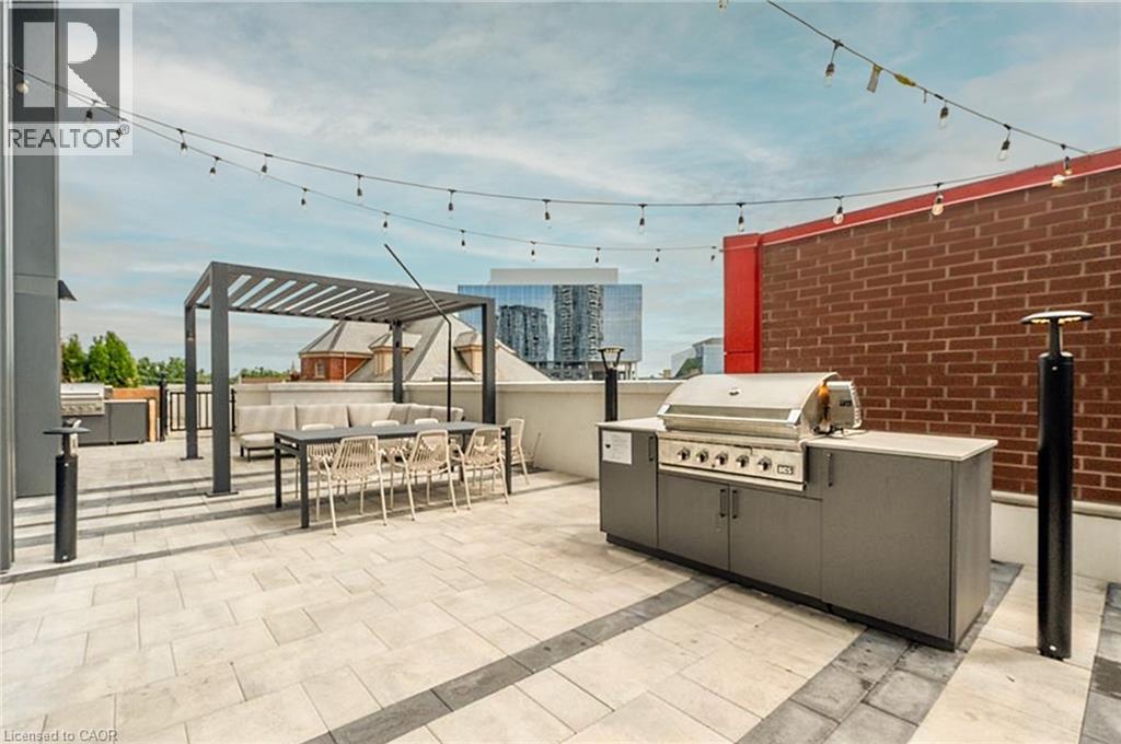 View of patio / terrace with an outdoor kitchen, area for grilling, a pergola, and an outdoor hangout area - 15 Wellington Street S Unit# 1909, Kitchener, ON - Outdoor