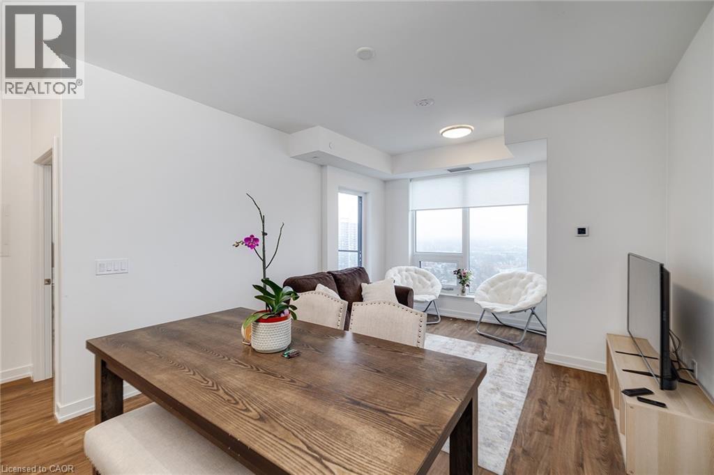 Dining space with hardwood / wood-style flooring - 15 Wellington Street S Unit# 1909, Kitchener, ON - Indoor