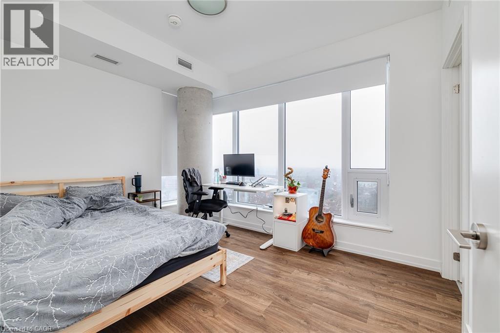 Bedroom featuring wood-type flooring - 15 Wellington Street S Unit# 1909, Kitchener, ON - Indoor Photo Showing Bedroom