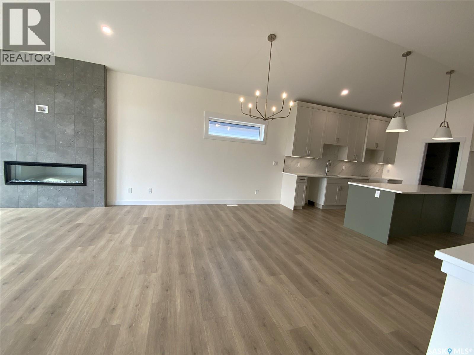 242 Doran Way, Saskatoon, SK - Indoor Photo Showing Kitchen With Fireplace With Upgraded Kitchen