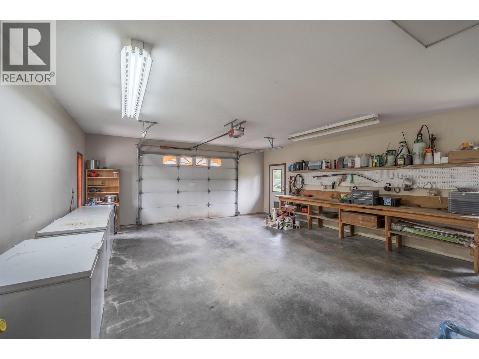 7497 Little Fort 24 Highway, Bridge Lake, BC - Indoor Photo Showing Garage