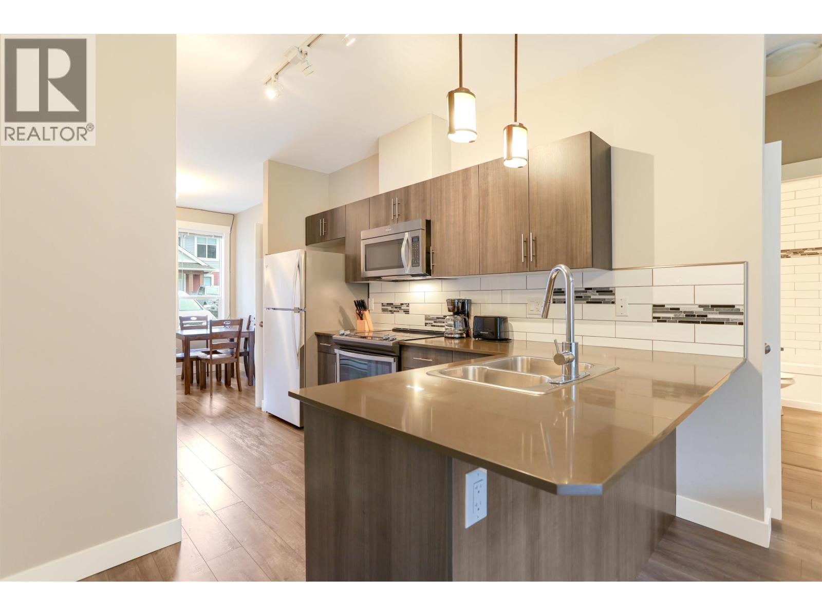 206 110 Baxter Avenue, Kitimat, BC - Indoor Photo Showing Kitchen With Stainless Steel Kitchen With Double Sink With Upgraded Kitchen