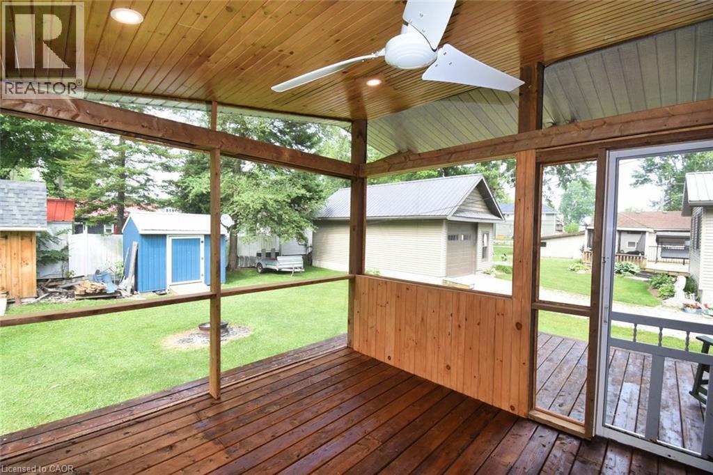 Screened porch featuring a wood-finish ceiling, recessed lighting, and a ceiling fan - 5 Ralph Street, Turkey Point, ON - Outdoor With Deck Patio Veranda With Exterior