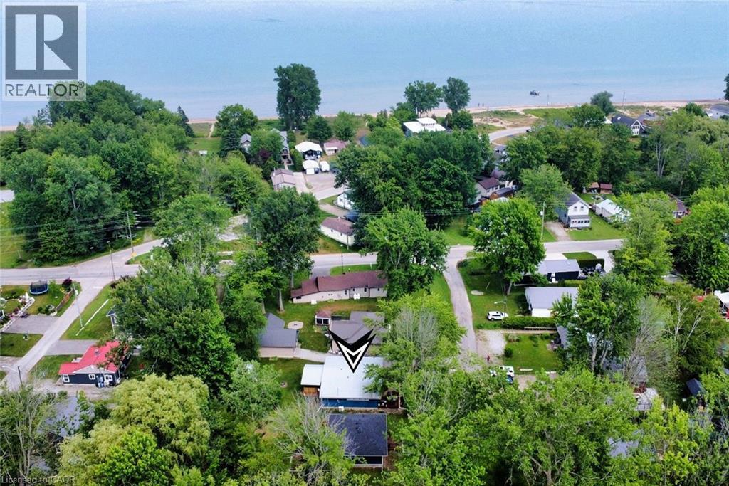 Aerial perspective showcasing the property's proximity to a body of water with a sandy shore - 5 Ralph Street, Turkey Point, ON - Outdoor With View