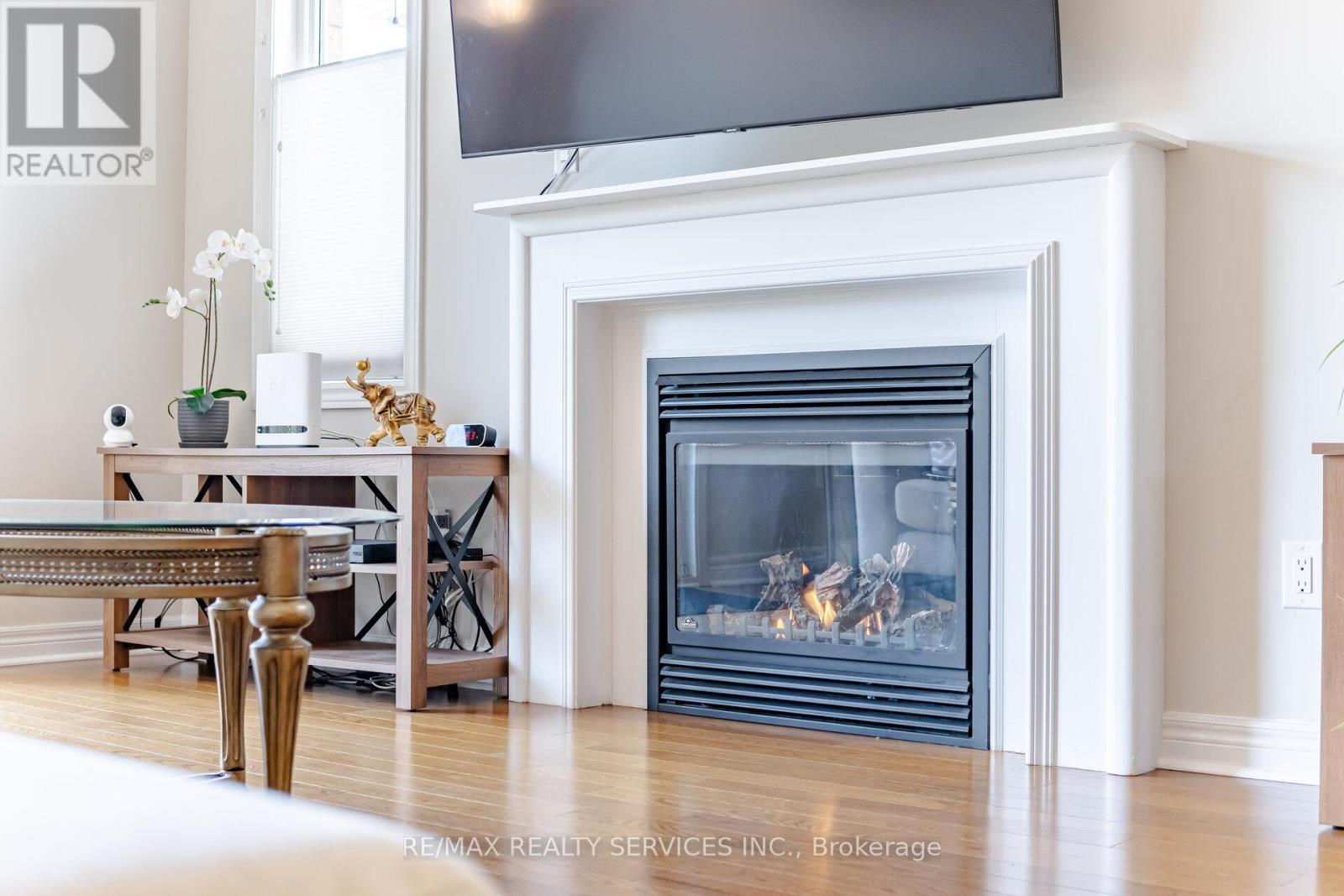 52 Atchison Drive, Caledon, ON - Indoor Photo Showing Living Room With Fireplace