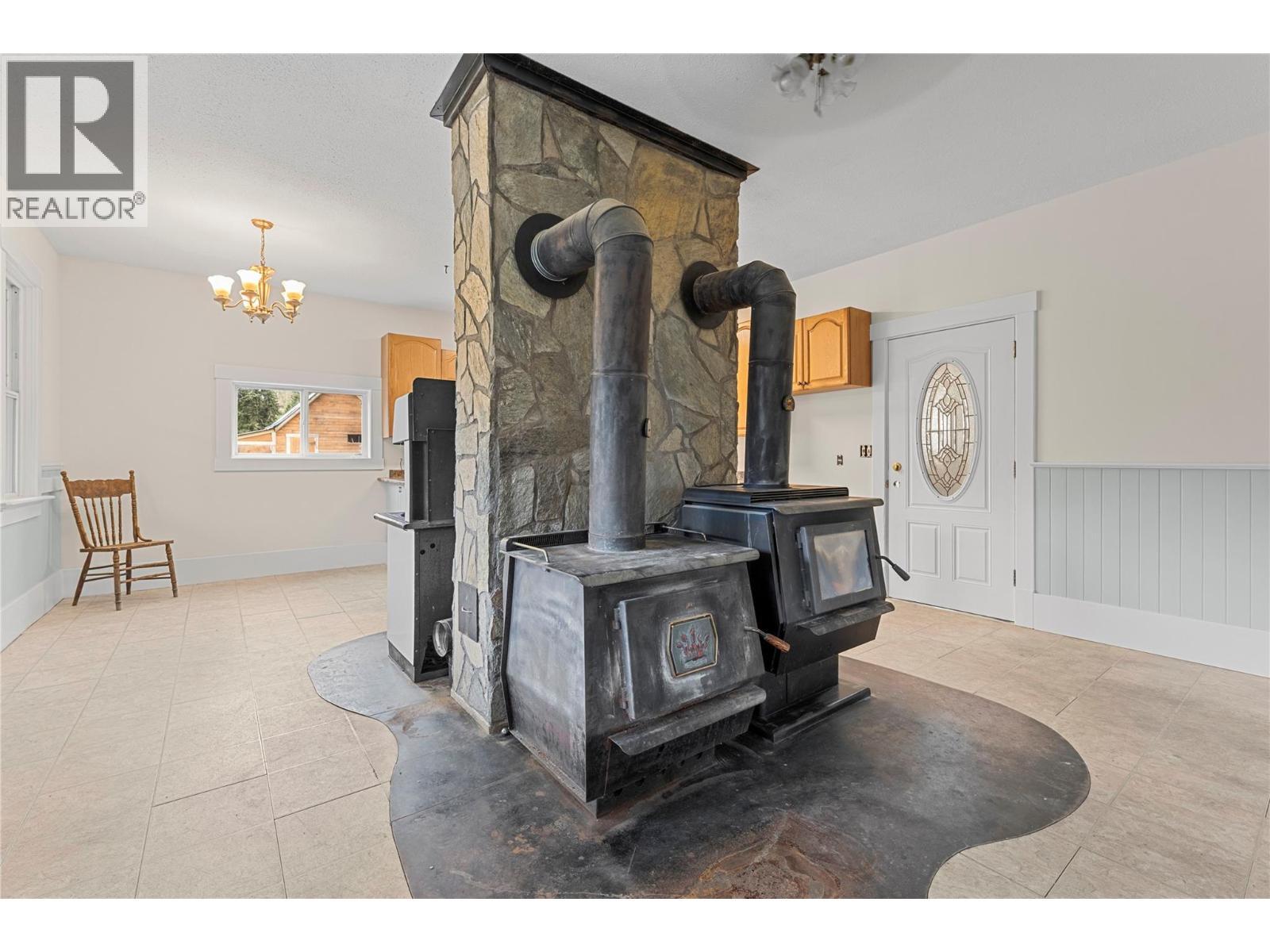main floor - 3135 Edes Road, Salmon Arm, BC - Indoor Photo Showing Other Room With Fireplace