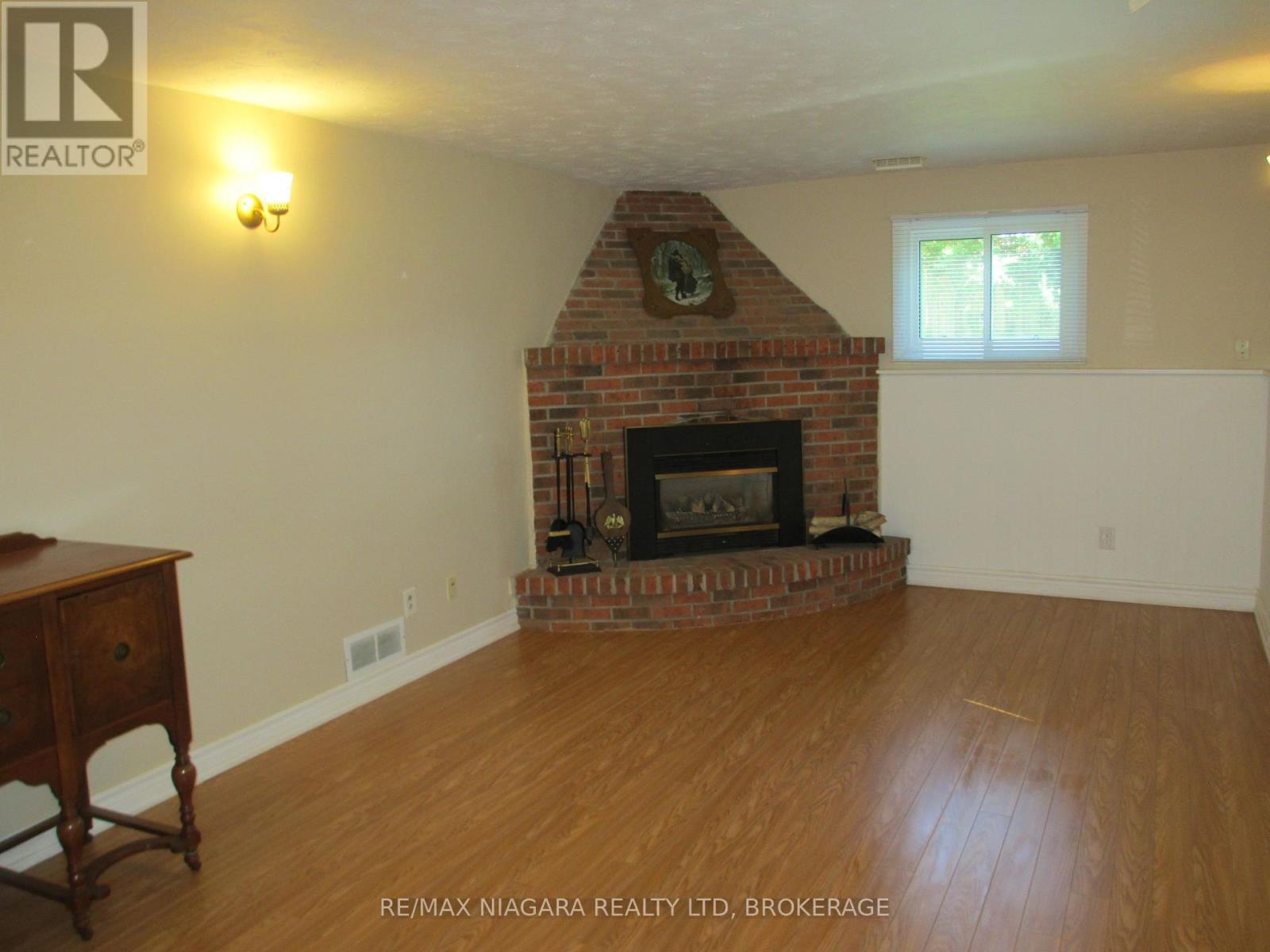 REC. ROOM - 1452 Garrison Road, Fort Erie (Crescent Park), ON - Indoor Photo Showing Living Room With Fireplace