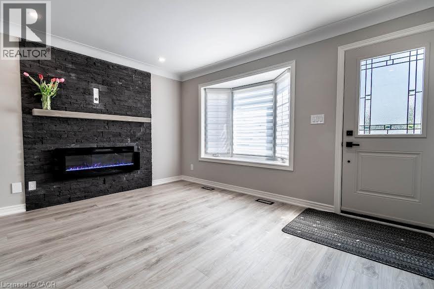 261 Scott Street Unit# B, St. Catharines, ON - Indoor Photo Showing Living Room With Fireplace