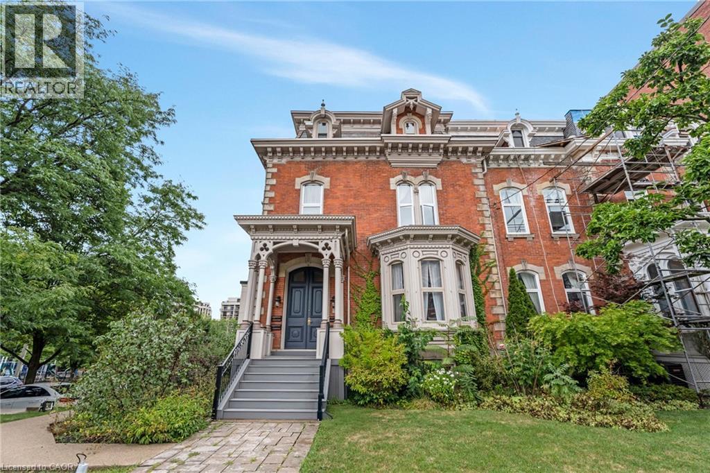 Italianate-style house featuring brick siding and a front lawn - 46 Herkimer Street Unit# 2, Hamilton, ON - Outdoor With Facade