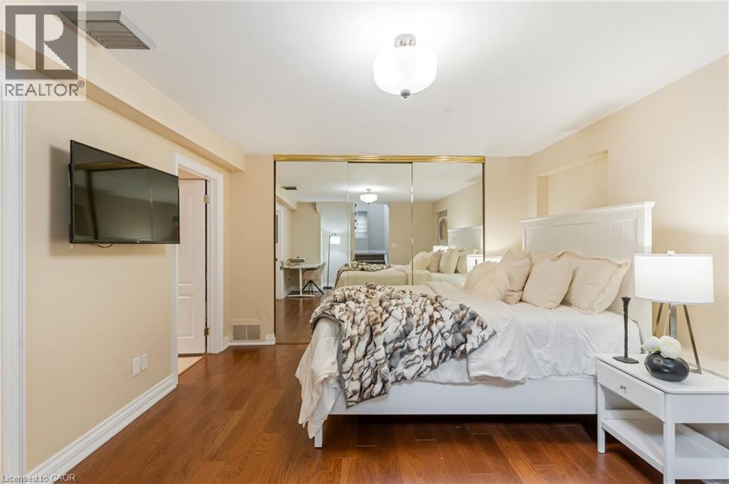 Bedroom with wood finished floors and a closet - 46 Herkimer Street Unit# 2, Hamilton, ON - Indoor Photo Showing Bedroom
