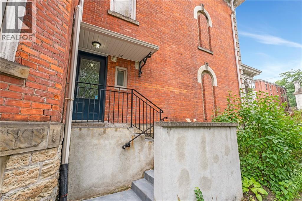 View of exterior entry featuring brick siding - 46 Herkimer Street Unit# 2, Hamilton, ON - Outdoor With Exterior