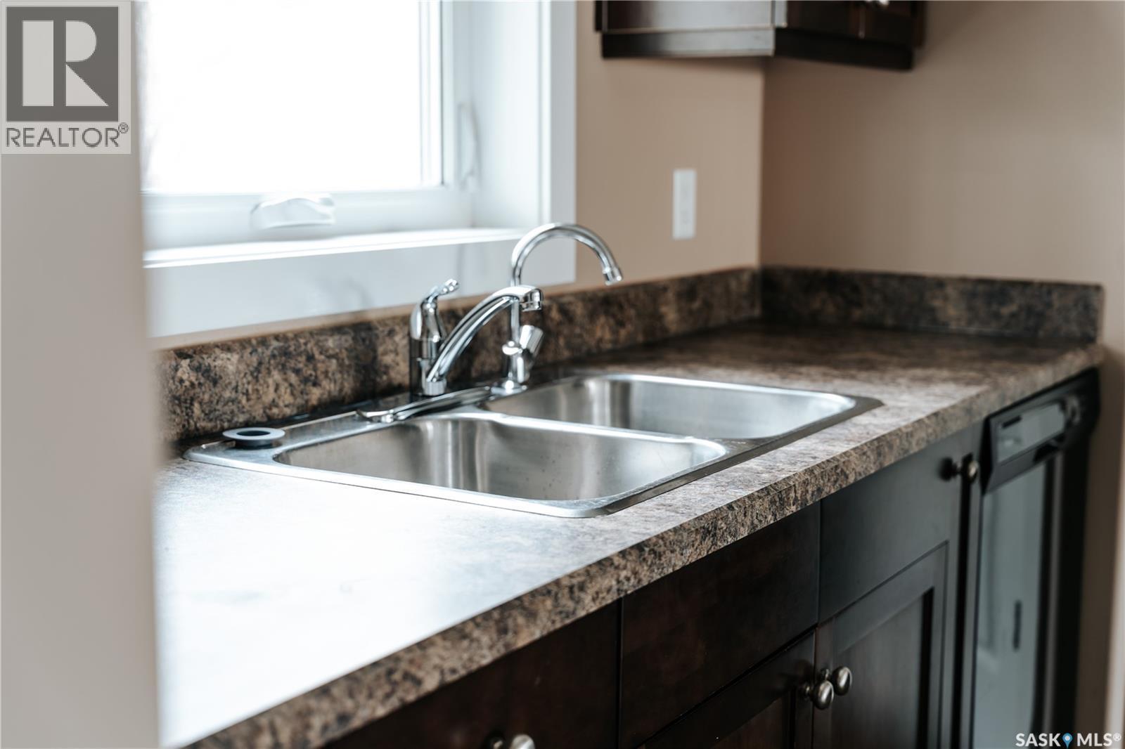 145 Mcintyre Street N, Regina, SK - Indoor Photo Showing Kitchen With Double Sink